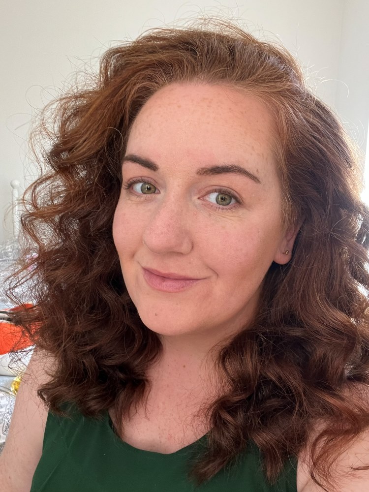 Anna, the baker behind Binge Bakes, smiling at home